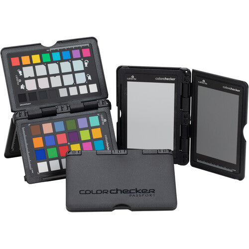 A Calibrite ColorChecker Passport Photo 2 with multiple color calibration targets for photography, displayed open to show the various color swatches, in a black case with an integrated stand and a lanyard.